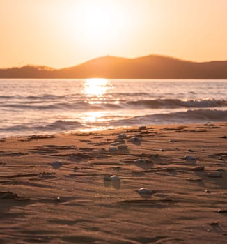 Sunset on the beach. Orange and golden sunset sky calmness tranquil relaxing sunlight summer mood.