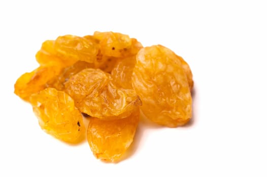 Close-up Falling yellow raisins isolated on white background with clipping path