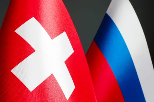 Flags of Switzerland and Russia as diplomacy concept.