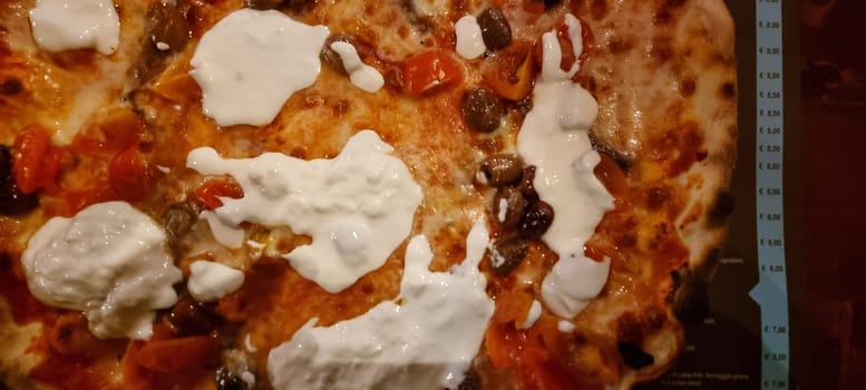 High-resolution image showcasing the delicious details of a topped italian pizza