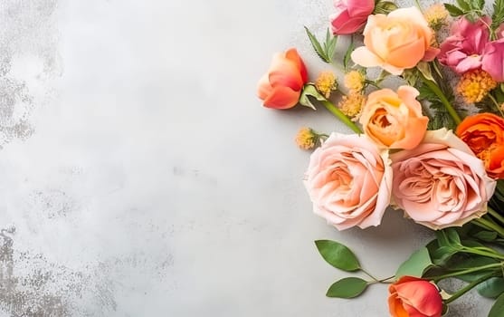 A bouquet of pink flowers is arranged on a grey background. The flowers are arranged in a way that they are not overlapping each other