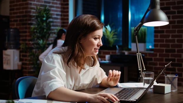 Happy employee reading email on laptop received from customer, excited after managing to secure lucrative deal for company. Businesswoman celebrating finalizing agreement with client, camera A