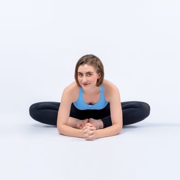 Full body length gaiety shot athletic and sporty woman doing healthy and meditative yoga exercise workout posture on isolated background. Healthy active and body care lifestyle