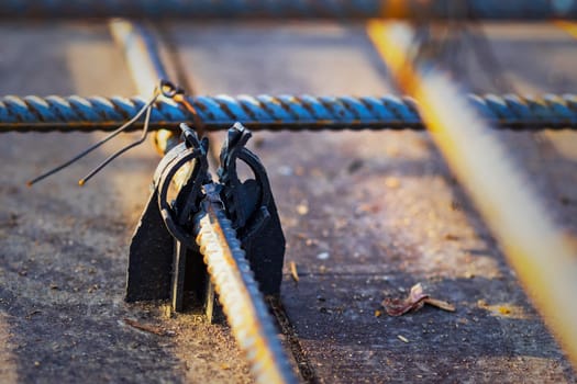 Close-up view of plastic rebar holders or supports serve as integral components in the construction of reinforced concrete structures.