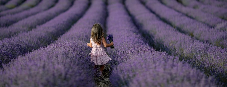 Lavender field girl banner. Back view happy girl in pink dress with flowing hair runs through a lilac field of lavender. Aromatherapy travel.