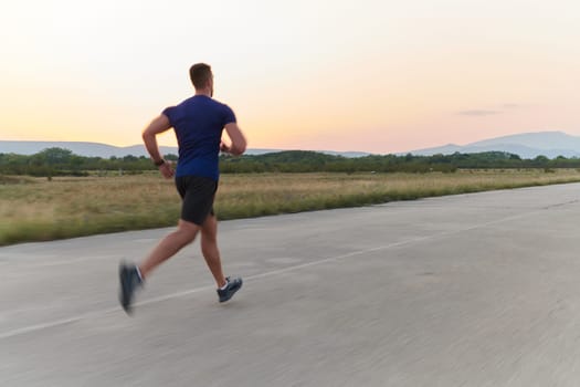 A highly motivated marathon runner displays unwavering determination as he trains relentlessly for his upcoming race, fueled by his burning desire to achieve his goals.