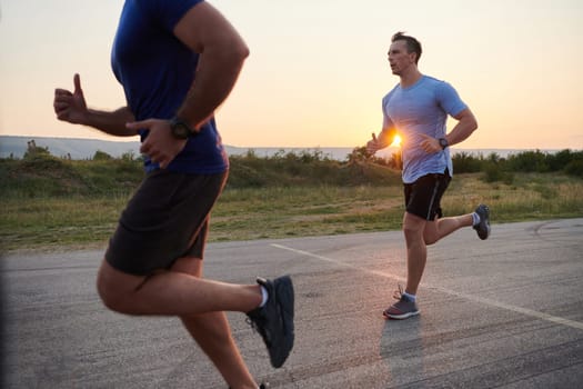 In anticipation of an upcoming marathon competition, two athletic friends train side by side, embodying the spirit of teamwork, dedication, and mutual support in their shared fitness journey.