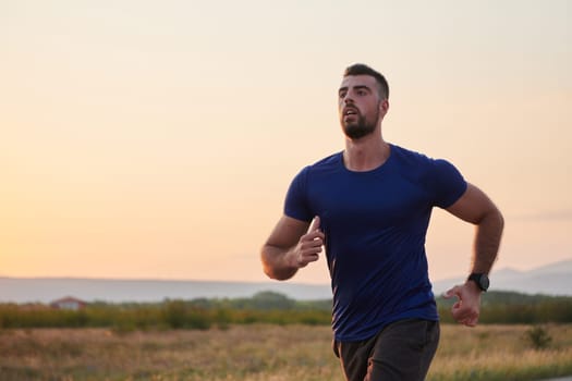 A highly motivated marathon runner displays unwavering determination as he trains relentlessly for his upcoming race, fueled by his burning desire to achieve his goals.