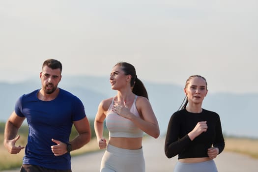 A group of friends maintains a healthy lifestyle by running outdoors on a sunny day, bonding over fitness and enjoying the energizing effects of exercise and nature.