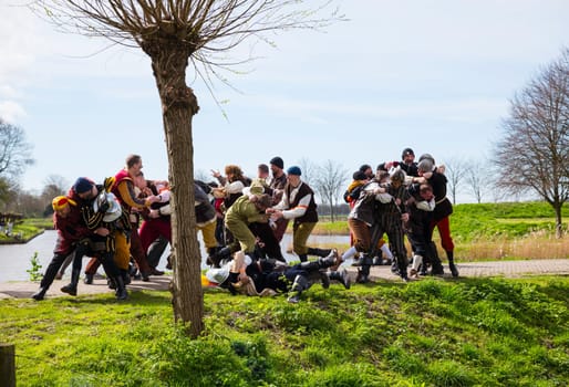 Brielle,Holland,1-04-2024:people in battle intraditional traditional costumes celebration of the the first town to be liberated from the Spanish in Den Briel in the Netherlands in 1572