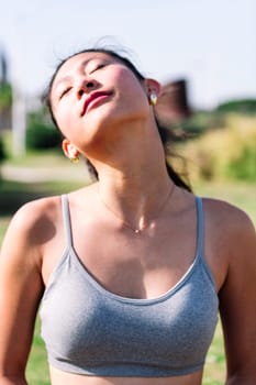 portrait of young asian woman doing relaxation exercises, active and healthy lifestyle concept