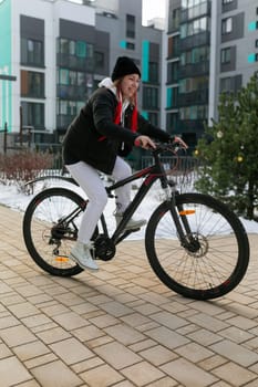 European woman rented a bike for a weekend in winter.