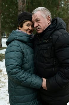 Mature husband and wife walking down the street.