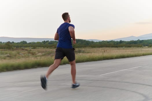 A highly motivated marathon runner displays unwavering determination as he trains relentlessly for his upcoming race, fueled by his burning desire to achieve his goals.