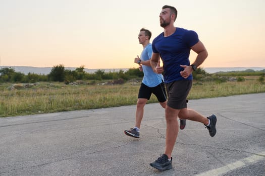 In anticipation of an upcoming marathon competition, two athletic friends train side by side, embodying the spirit of teamwork, dedication, and mutual support in their shared fitness journey.