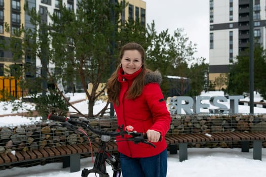 Caucasian woman rented a bicycle for a weekend in winter.