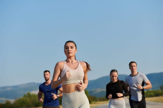 A group of friends maintains a healthy lifestyle by running outdoors on a sunny day, bonding over fitness and enjoying the energizing effects of exercise and nature.