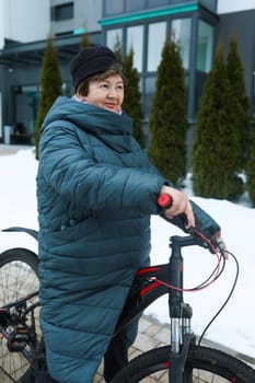 Mature European woman extends longevity and rides a bicycle.
