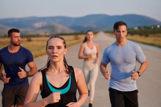 A group of friends maintains a healthy lifestyle by running outdoors on a sunny day, bonding over fitness and enjoying the energizing effects of exercise and nature.