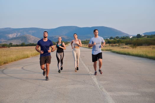 A group of friends maintains a healthy lifestyle by running outdoors on a sunny day, bonding over fitness and enjoying the energizing effects of exercise and nature.