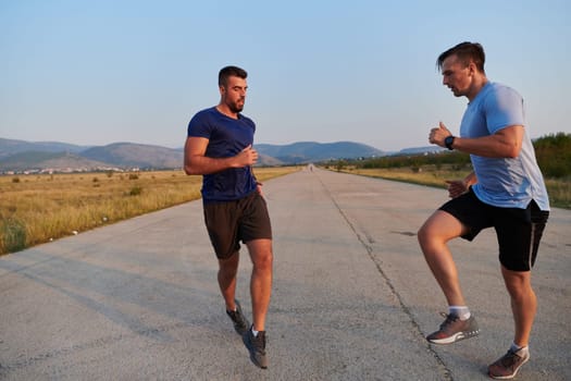 In anticipation of an upcoming marathon competition, two athletic friends train side by side, embodying the spirit of teamwork, dedication, and mutual support in their shared fitness journey.