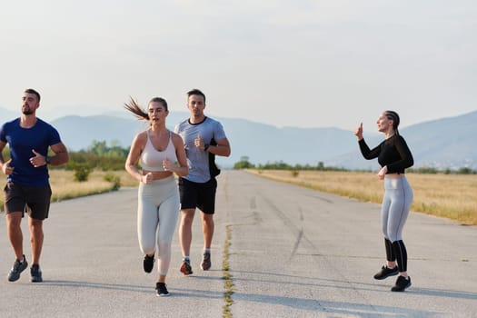 A group of friends maintains a healthy lifestyle by running outdoors on a sunny day, bonding over fitness and enjoying the energizing effects of exercise and nature.