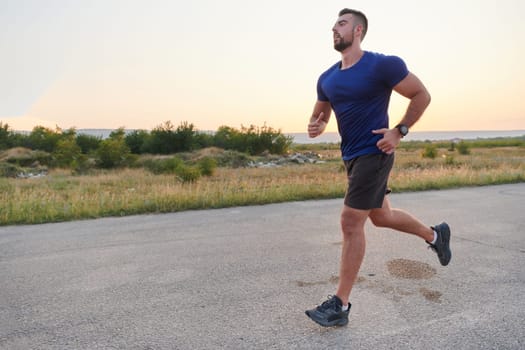 A highly motivated marathon runner displays unwavering determination as he trains relentlessly for his upcoming race, fueled by his burning desire to achieve his goals.