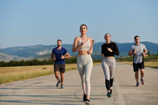 A group of friends maintains a healthy lifestyle by running outdoors on a sunny day, bonding over fitness and enjoying the energizing effects of exercise and nature.