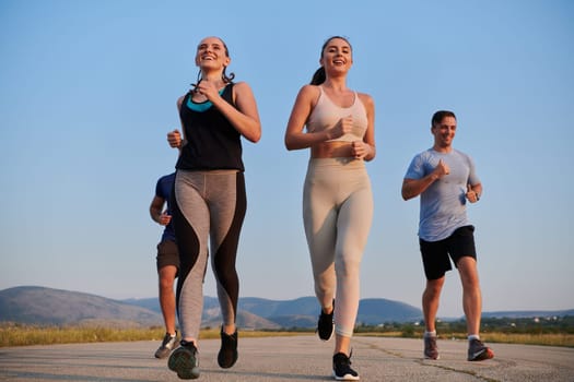 A group of friends maintains a healthy lifestyle by running outdoors on a sunny day, bonding over fitness and enjoying the energizing effects of exercise and nature.