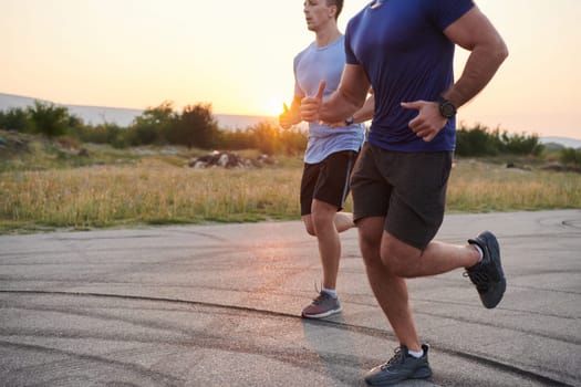 In anticipation of an upcoming marathon competition, two athletic friends train side by side, embodying the spirit of teamwork, dedication, and mutual support in their shared fitness journey.