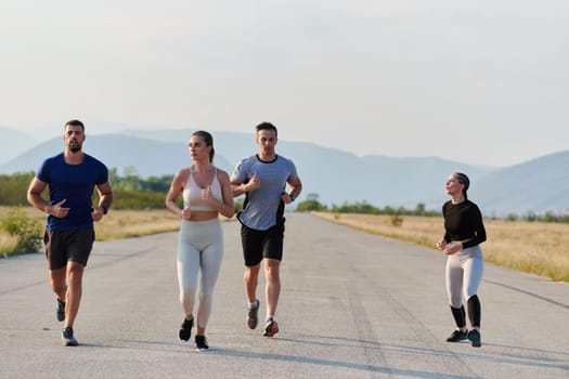 A group of friends maintains a healthy lifestyle by running outdoors on a sunny day, bonding over fitness and enjoying the energizing effects of exercise and nature.