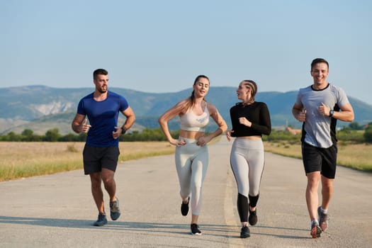 A group of friends maintains a healthy lifestyle by running outdoors on a sunny day, bonding over fitness and enjoying the energizing effects of exercise and nature.