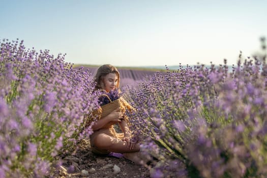 Girl is sitting in a field of purple flowers. She is holding a basket of flowers and smiling. Scene is peaceful and serene, as the girl is surrounded by the beauty of nature