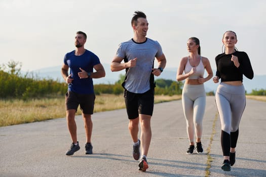 A group of friends maintains a healthy lifestyle by running outdoors on a sunny day, bonding over fitness and enjoying the energizing effects of exercise and nature.