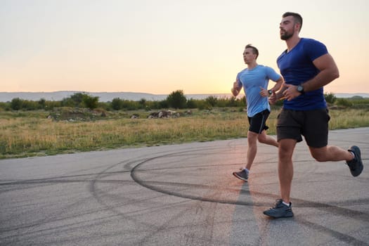 In anticipation of an upcoming marathon competition, two athletic friends train side by side, embodying the spirit of teamwork, dedication, and mutual support in their shared fitness journey.