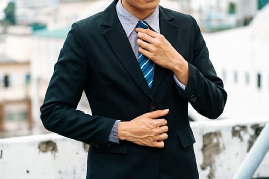 Body of businessman wearing formal business suit. Workplace fashion. uds