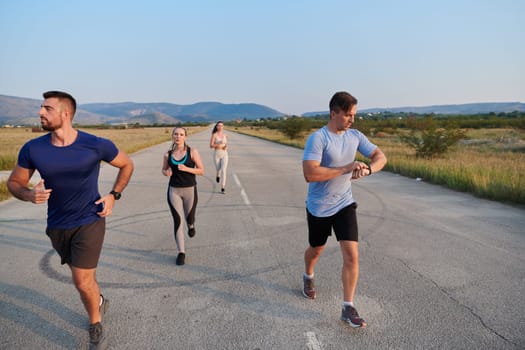 A group of friends maintains a healthy lifestyle by running outdoors on a sunny day, bonding over fitness and enjoying the energizing effects of exercise and nature.