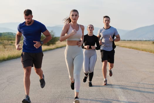 A group of friends maintains a healthy lifestyle by running outdoors on a sunny day, bonding over fitness and enjoying the energizing effects of exercise and nature.