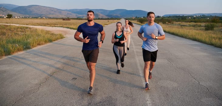 A group of friends maintains a healthy lifestyle by running outdoors on a sunny day, bonding over fitness and enjoying the energizing effects of exercise and nature.