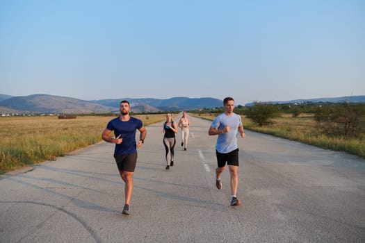 A group of friends maintains a healthy lifestyle by running outdoors on a sunny day, bonding over fitness and enjoying the energizing effects of exercise and nature.