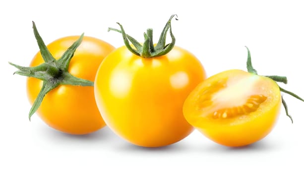 Yellow Tomato isolated on a white backdrop. High quality photo