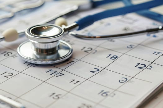A stethoscope resting on a calendar, marking important healthcare check-ups and appointments.