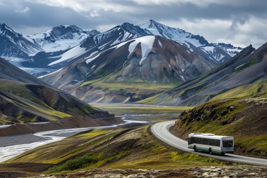 A vintage red bus navigates a twisting mountain road amidst a tranquil landscape of snow-capped peaks and lush greenery under a warm, cloud-streaked sky