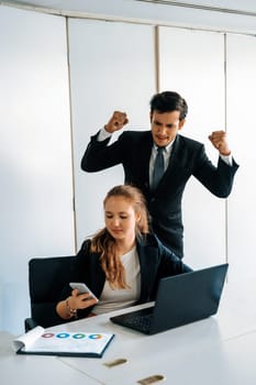 Businessman boss feels angry and mad at bad misbehaving businesswoman employee who ignores the work tasks at the workplace. Firing workers and human resources management problem concept. uds