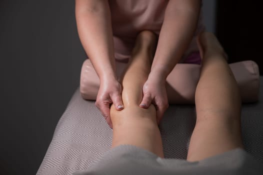 Close-up of a woman's leg massage in a salon