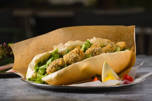 Deep fried mussels in bread and with greens on the side. Turkish name Midye Tava