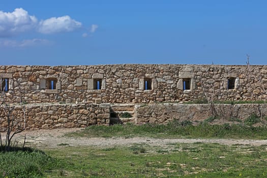 Fortezza fortress castle in Crete island holidays exploring the old ancient stone city monuments close up summer background carnival season high quality big size printings