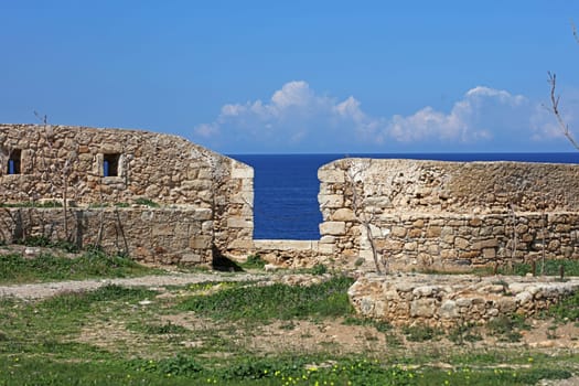 Fortezza fortress castle in Crete island holidays exploring the old ancient stone city monuments close up summer background carnival season high quality big size printings