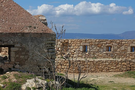 Fortezza fortress castle in Crete island holidays exploring the old ancient stone city monuments close up summer background carnival season high quality big size printings