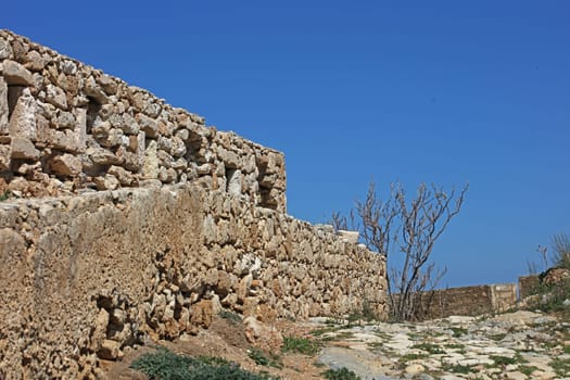 Fortezza fortress castle in Crete island Rethimno holidays exploring the old ancient stone city monuments close up summer background carnival season high quality big size printings